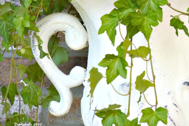 Outdoor garden urns in old white