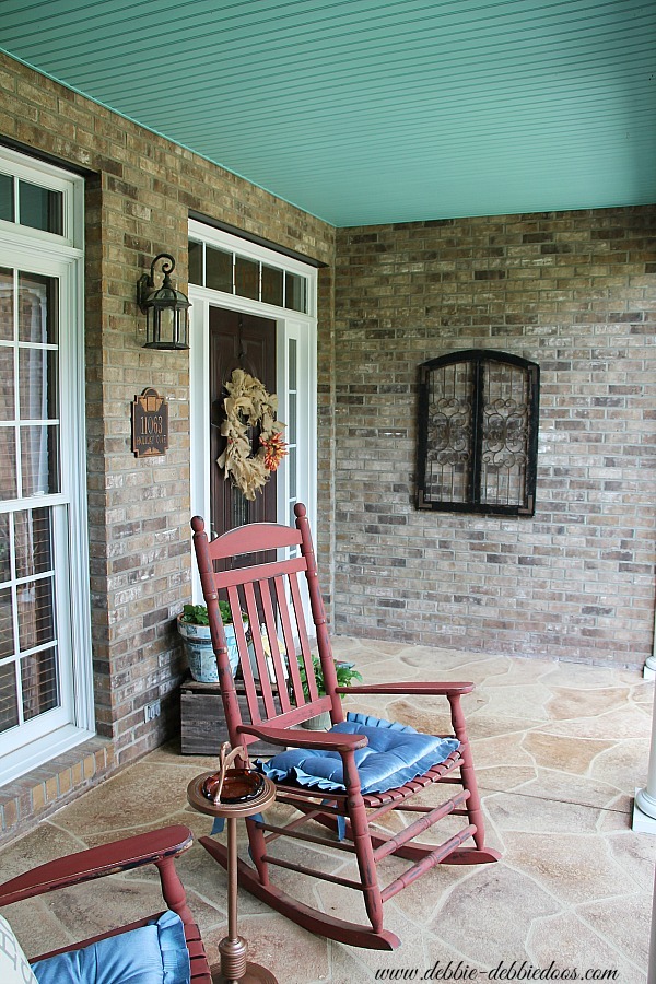 Rustic southern porch with haint blue ceiling