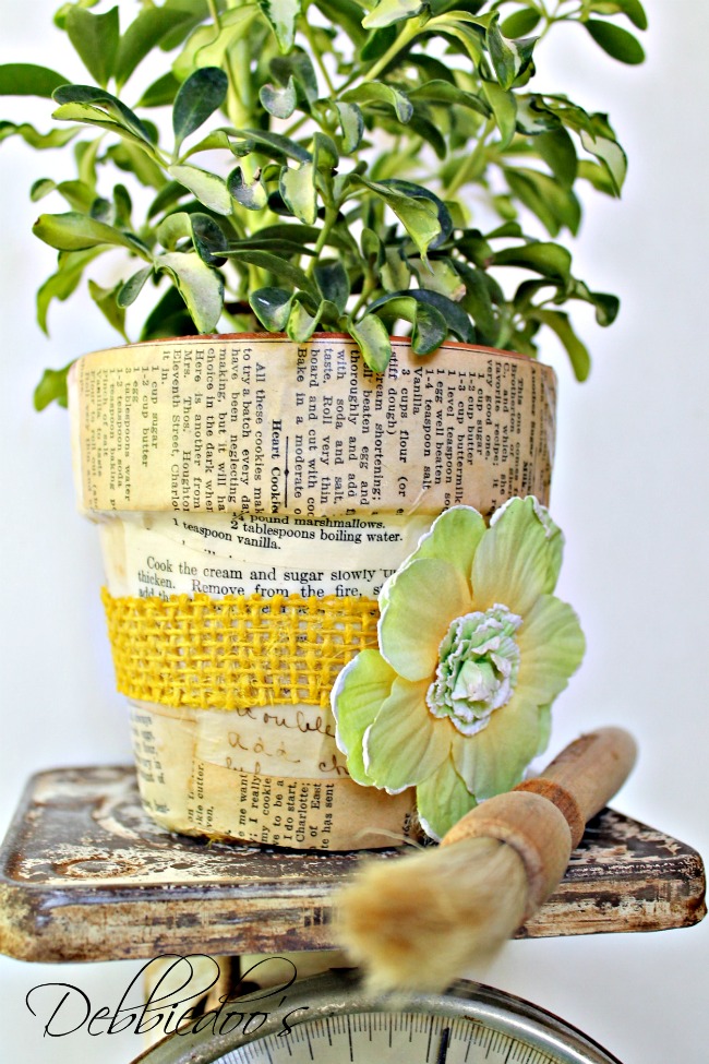 Mod podge terra cotta pots with fabric and a vintage recipe book 002