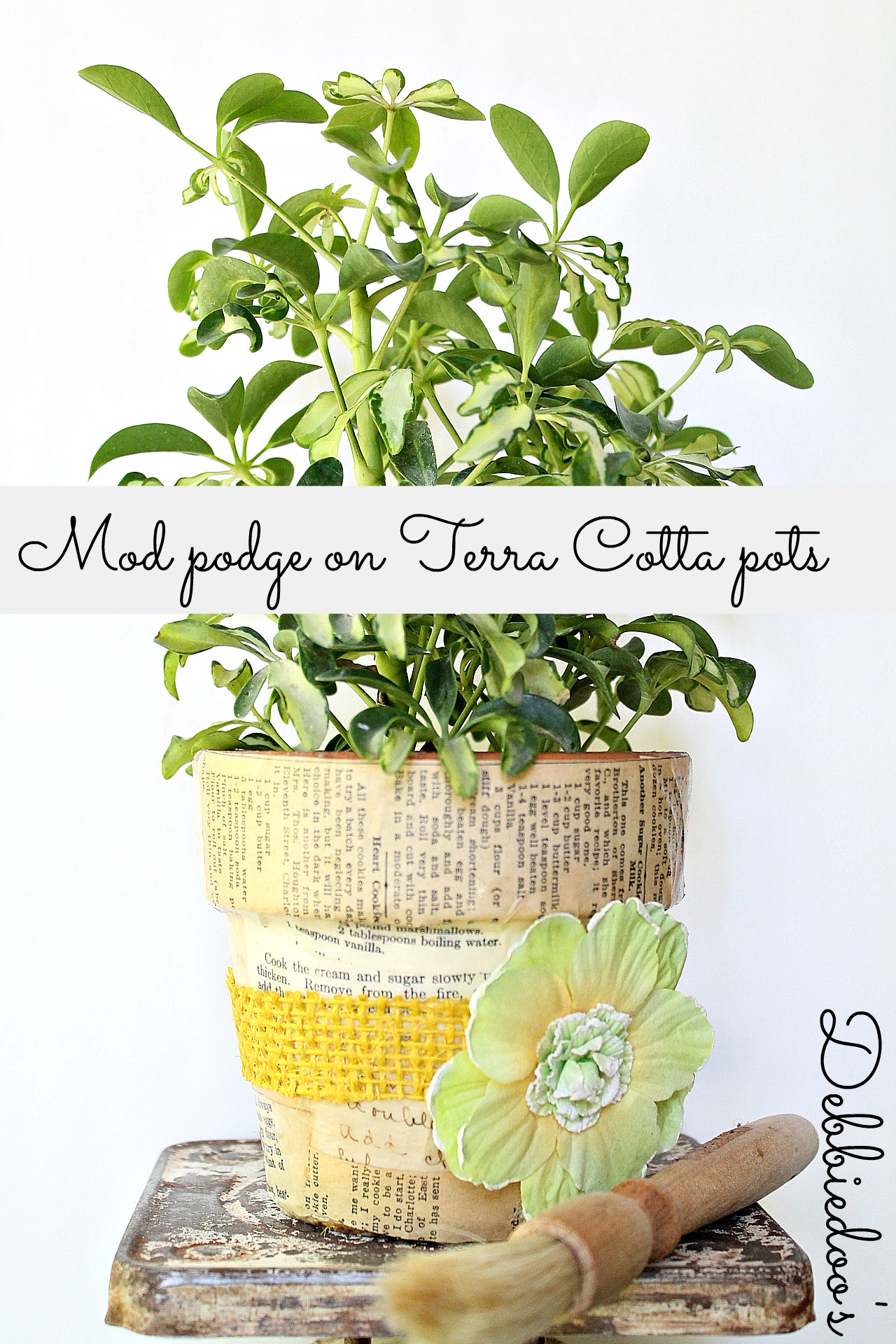Mod podge terra cotta pots with fabric and a vintage recipe book 