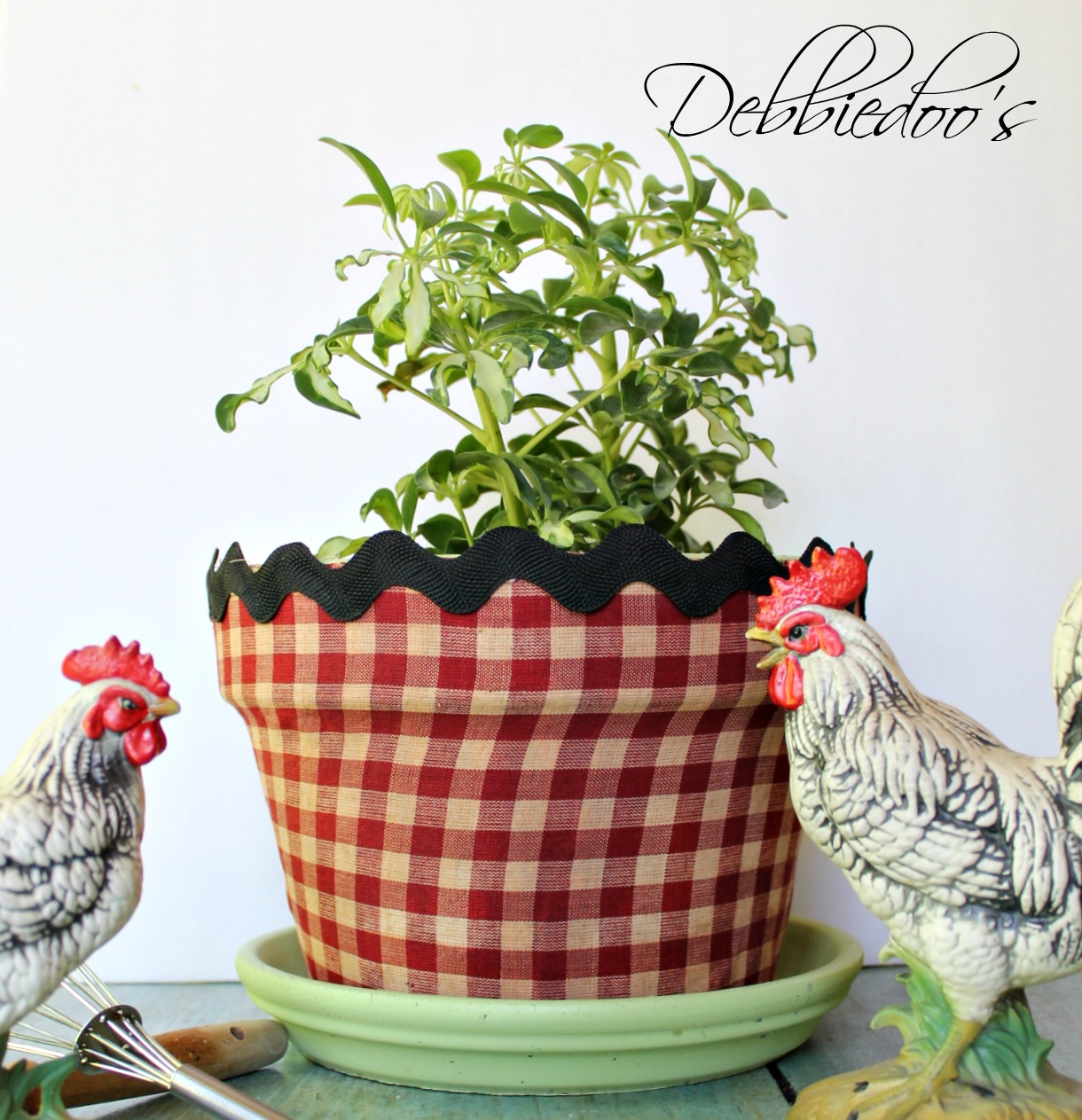 Mod podge terra cotta pots with fabric and a vintage recipe book 021