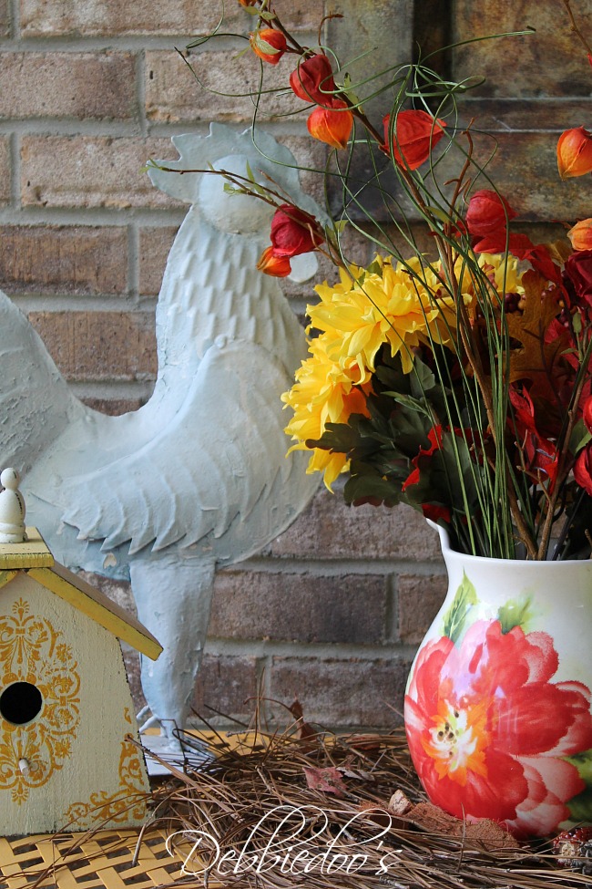 Fall porch rooster and flower vignette