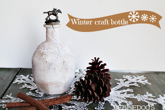 Winter bourbon bottle crafted with paint and mod podge