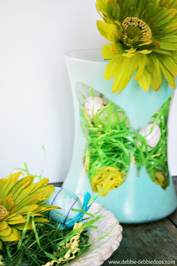 Dollar tree spray painted vase with foam butterfly silhouette