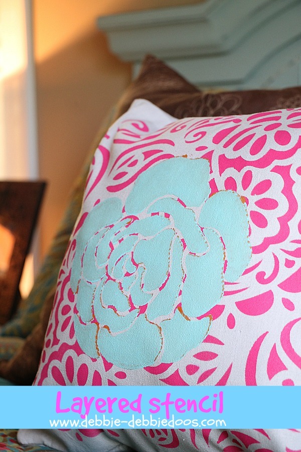 layered stenciled pillow with tulip