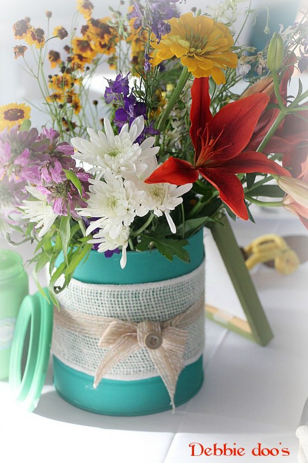 cans painted with chalky paint for garden wedding centerpieces