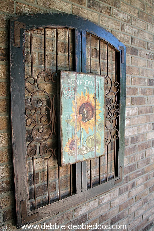 Sunflower picture on iron rustic gate