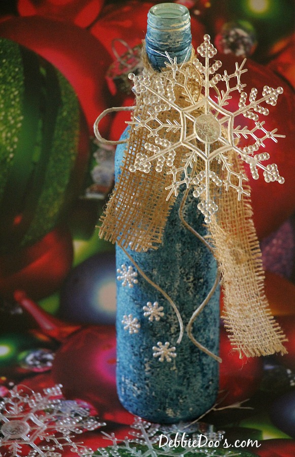 Christmas embellished and painted wine bottle