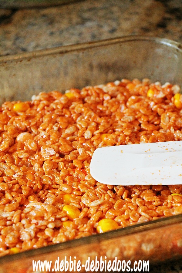 Making pumpkin rice krispie treats