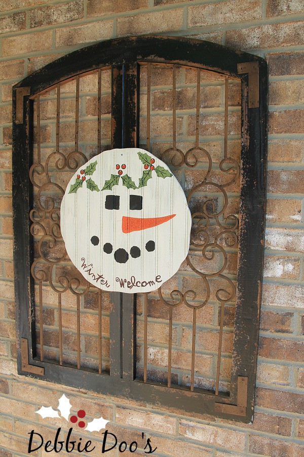 Decorating on the porch for Christmas Snowman pallet sign
