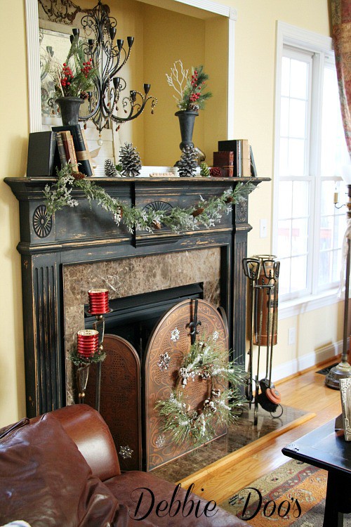 Winter decorating the family room with greens and berries