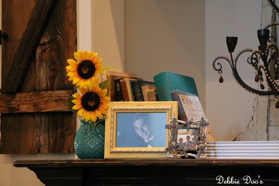 decorating the mantel with photos and old books