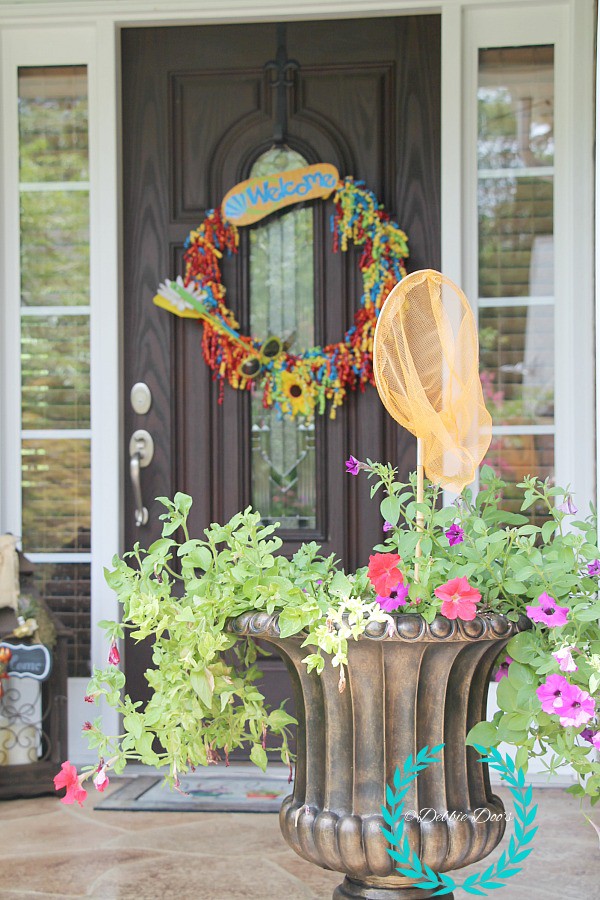 Southern porch with a whimsical twist and a fun wreath idea. Dollar tree decor and more..