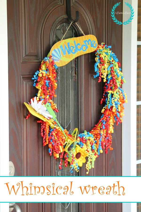 Whimsical wreath idea with dollar tree goods. You can't believe what I used!