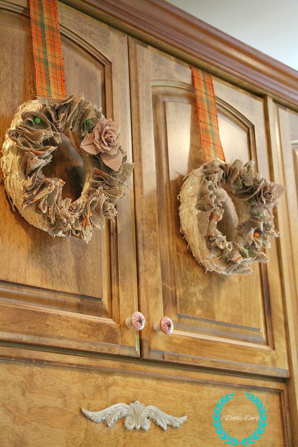 mini cabinet wreaths for fall decor in the kitchen