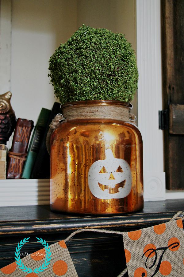 pumpkin vase on fall mantel from Home goods