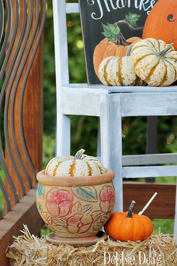 Decorating with pumpkins and gourds outdoors
