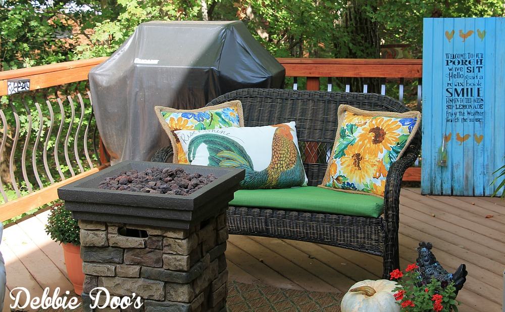 decorating an outdoor bench for the fall season