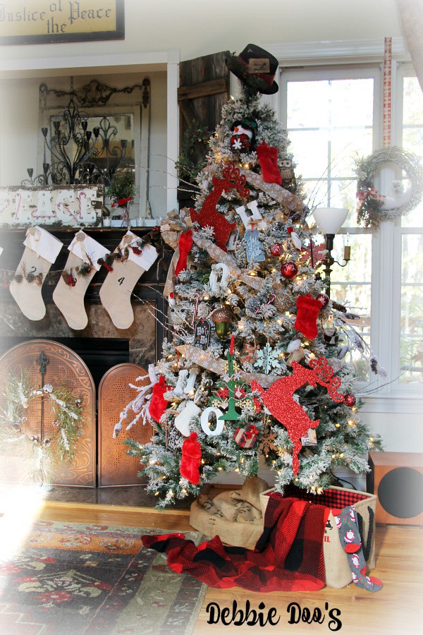 Flocked Christmas tree decorated with traditional colors and whimsy