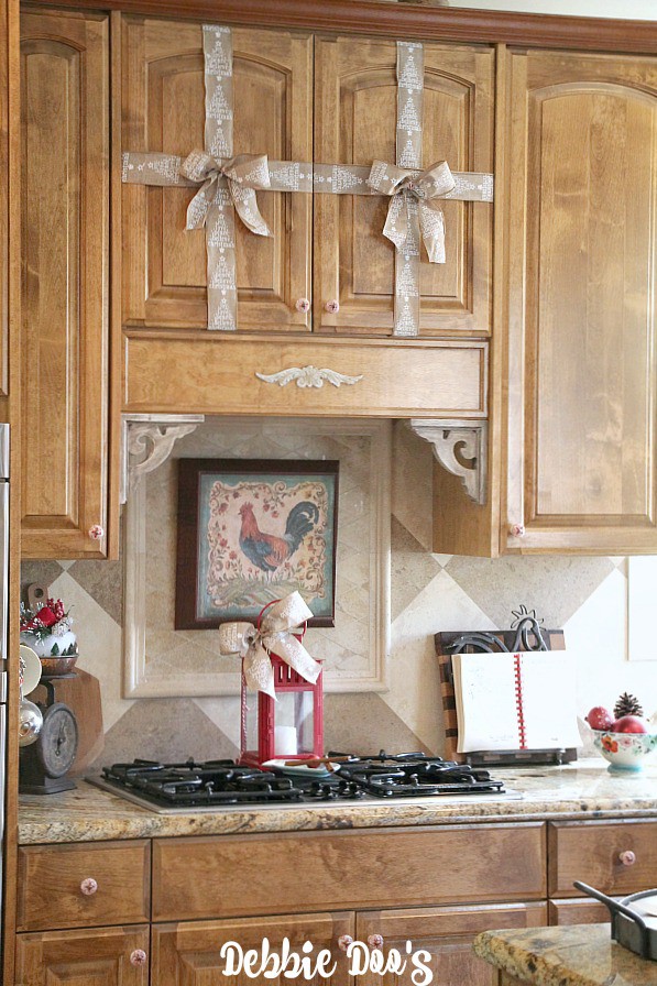 Decorating the cabinets with burlap ribbon and bows