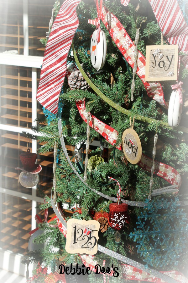 Mini tree decorated with Dollar tree Christmas ornaments for the front porch