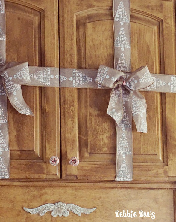 Present ribbon wrapping on cabinets for Christmas decor ideas
