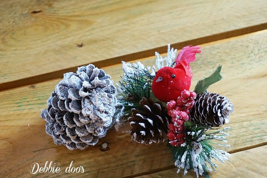 snowy pinecones and cardinal