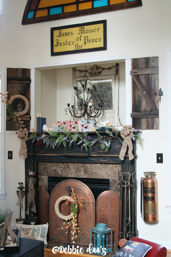 Spring mantel with burlap, birds and wildflowers