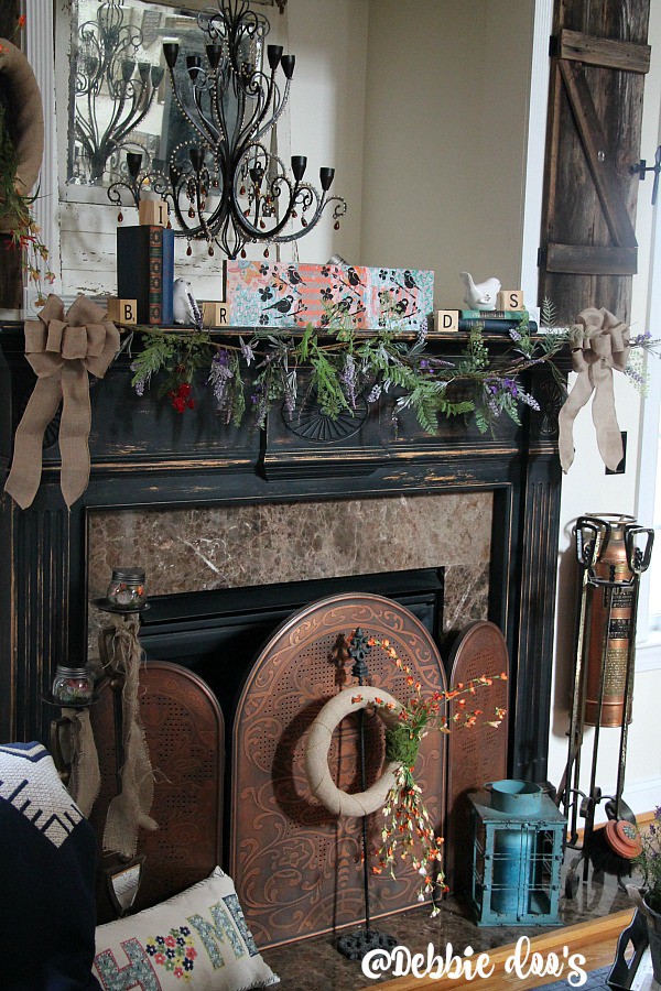Spring mantel with wildflowers, birds and burlap