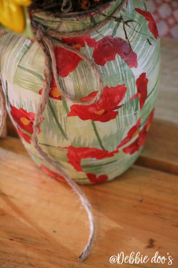Mod podge a vase with wrapping paper