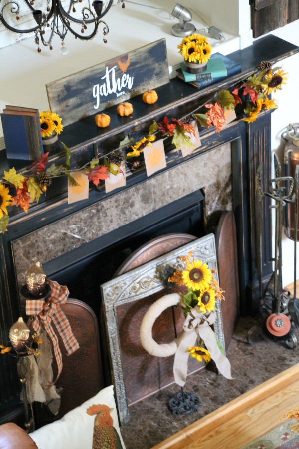 Fall mantel at Debbiedoo's with sunflowers, owls